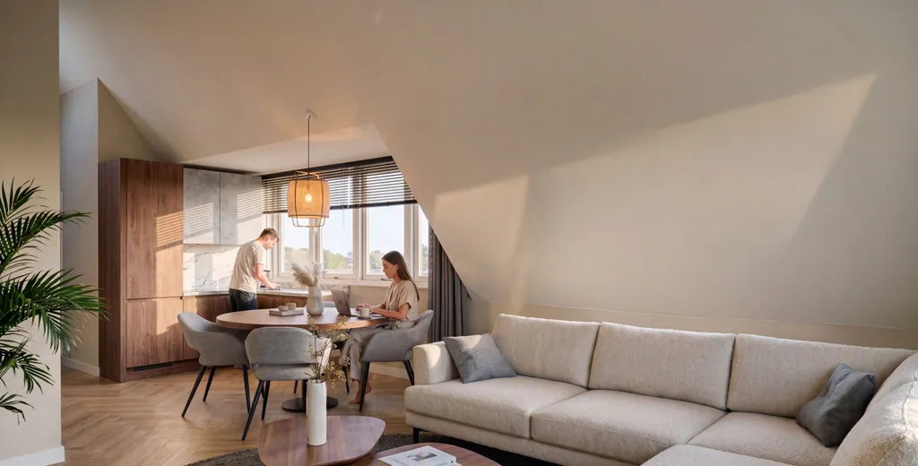 Woonkamer met keuken onder de kap in Le Ciel